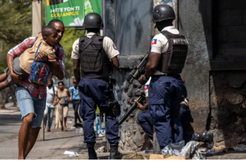 Haiti-gangs-man-fleeting-with-child